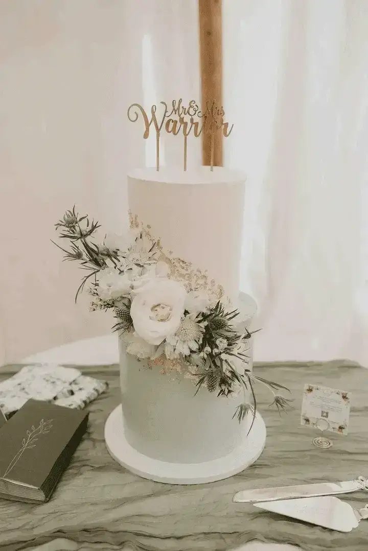 Modern two-tier wedding cake with Mr and Mrs topper