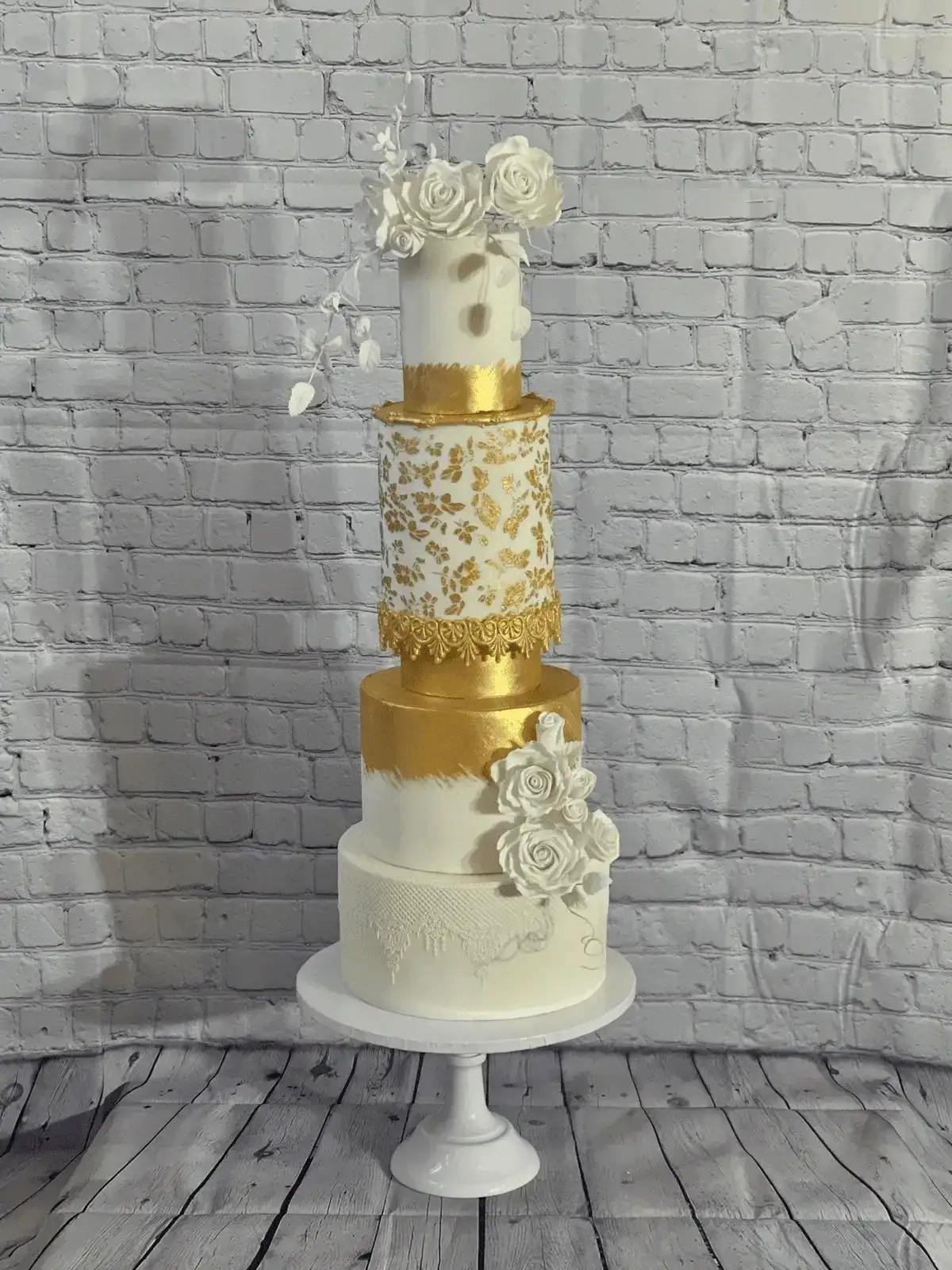 Luxury white and gold multi-tier wedding cake