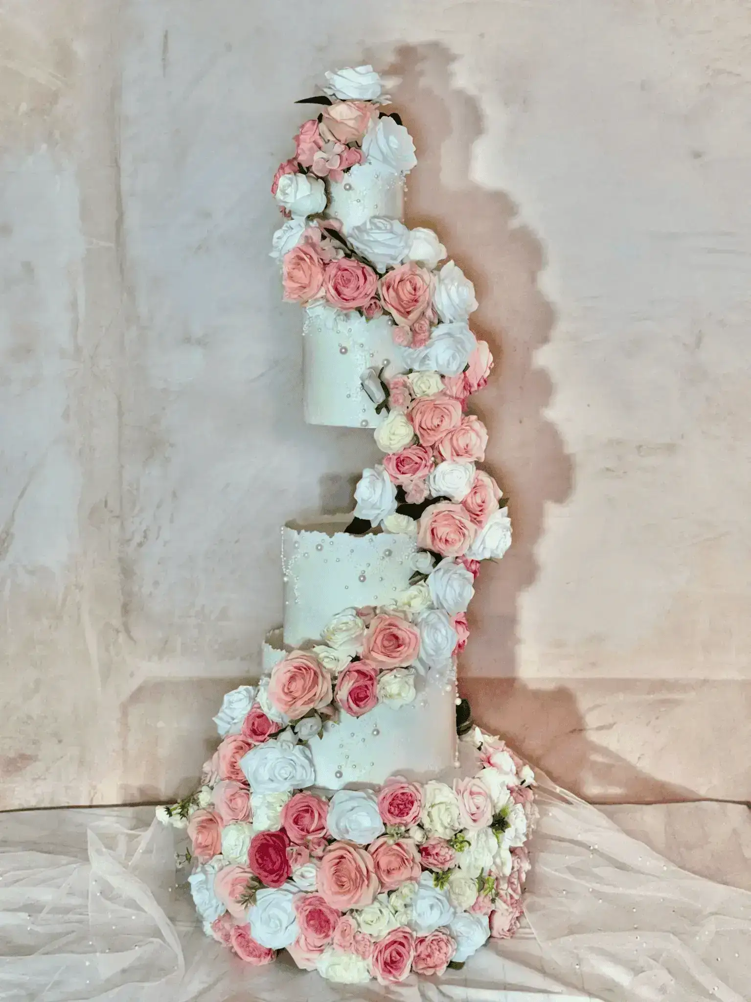 Elegant tiered wedding cake with sugar flowers