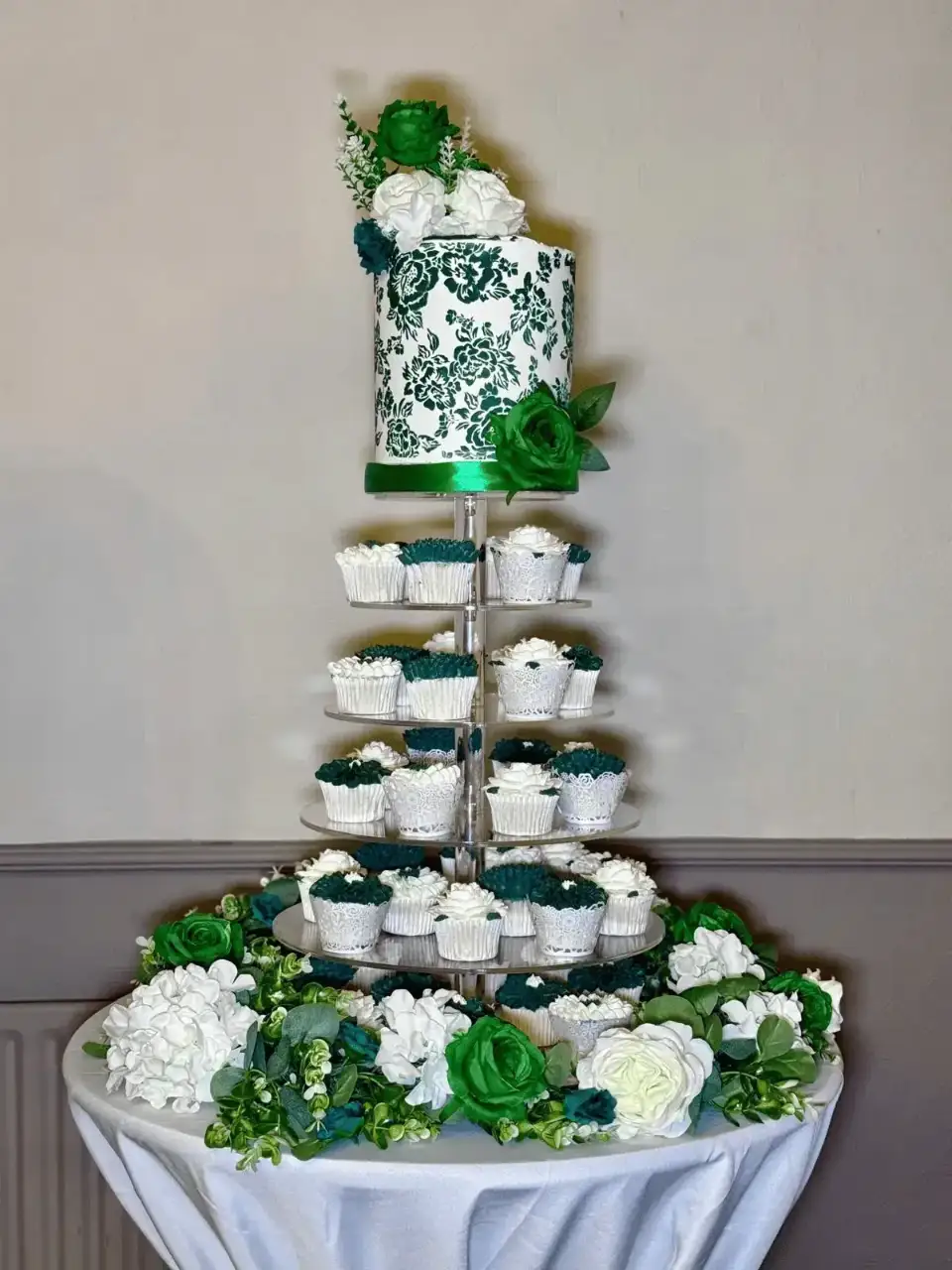 Cupcake tower dessert table with floral display
