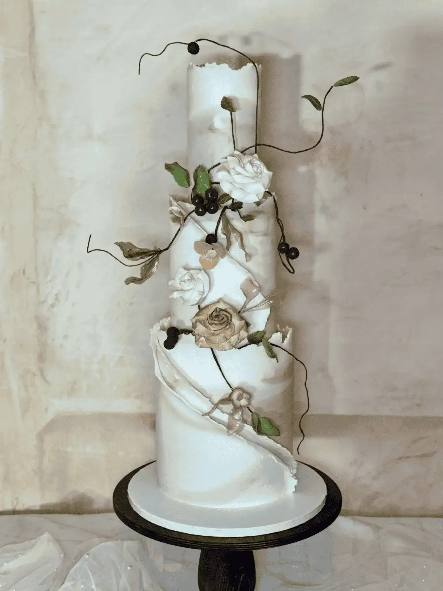Luxury white and blush wedding cake with floral petals